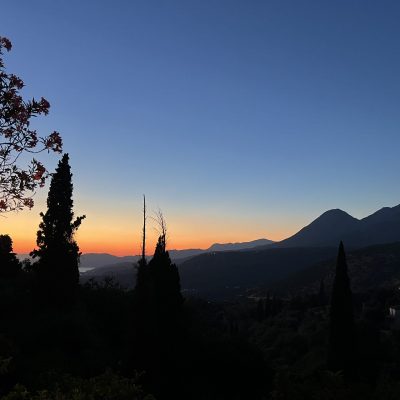 Sunset casts a warm glow over the mountains of Kardamyli in Mani, highlighting the serene landscape.